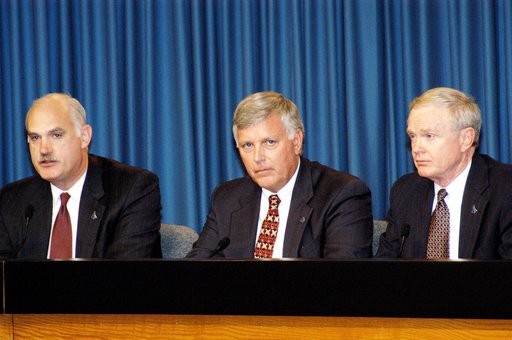 KENNEDY SPACE CENTER, FLA. -  NASA officials participate in a press conference in KSC's Press Site Auditorium. From left are NASA Associate Administrator for Space Flight William F. Readdy, KSC Deputy Director James W. Kennedy, and KSC Director Roy D. Bridges. The press conference followed the offic