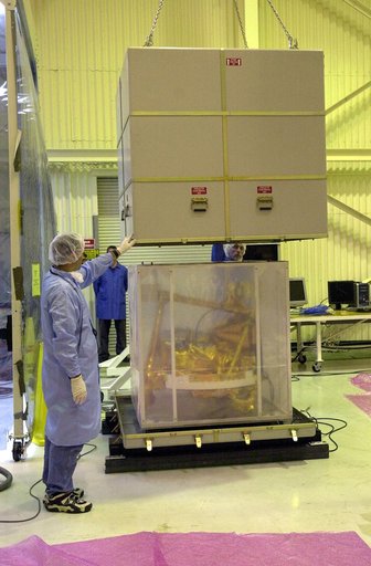 KENNEDY SPACE CENTER, FLA. -  The SciSat-1 spacecraft is uncrated at Vandenberg Air Force Base, Calif.  SciSat-1 weighs approximately 330 pounds and will be placed in a 400-mile-high polar orbit to investigate processes that control the distribution of ozone in the upper atmosphere.  The scientific 