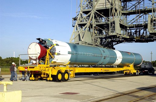 KENNEDY SPACE CENTER, FLA. -   On Launch Complex 17-B, Cape Canaveral Air Force Station, the first stage of a Delta II rocket waits to be lifted up and moved into the mobile service tower.  The rocket is being erected to launch the Space InfraRed Telescope Facility (SIRTF).  Consisting of an 0.85-me