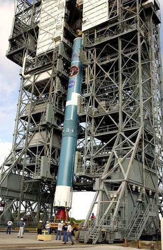 KENNEDY SPACE CENTER, FLA. -   On Launch Complex 17-B, Cape Canaveral Air Force Station, the first stage of a Delta II rocket is moved into the mobile service tower.  The rocket is being erected to launch the Space InfraRed Telescope Facility (SIRTF).  Consisting of an 0.85-meter telescope and three