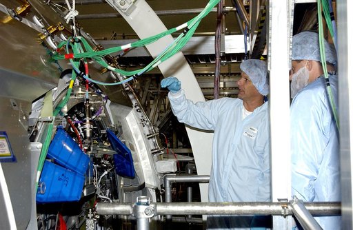 KENNEDY SPACE CENTER, FLA. - STS-120 Mission Specialists Piers Sellers and Michael Foreman look at the Japanese Experiment Module (JEM) Pressurized Module located in the Space Station Processing Facility. Known as Kibo, the JEM consists of six components: two research facilities -- the Pressurized M