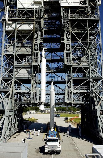 KENNEDY SPACE CENTER, FLA. -   Another solid rocket booster (SRB) is lifted to vertical on Launch Complex 17-B, Cape Canaveral Air Force Station, to join the one already in place in the mobile service tower.  The SRBs will be attached to the Delta II Heavy rocket that will launch the Space Infrared 