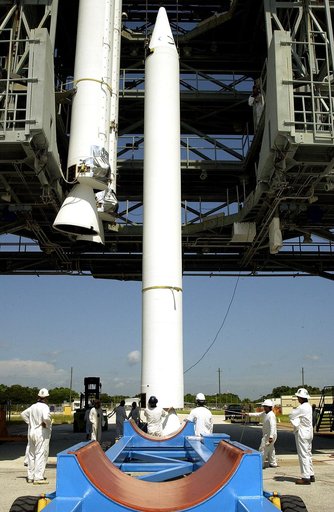 KENNEDY SPACE CENTER, FLA. -   On Launch Complex 17-B, Cape Canaveral Air Force Station, a solid rocket booster (SRB) is lifted into the mobile service tower, joining two others.  They are three of nine  46-inch-diameter, stretched SRBs that are being attached to the Delta II Heavy rocket that will 