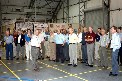 KENNEDY SPACE CENTER, FLA.  -   The Stafford-Covey Return to Flight Task Group (SCTG) visits the Columbia Debris Hangar .  Chairing the task group are Richard O. Covey (third from right), former Space Shuttle commander, and Thomas P. Stafford (fourth from right), Apollo commander.  Chartered by NASA