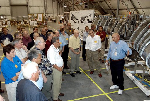 KENNEDY SPACE CENTER, FLA.  -  The Stafford-Covey Return to Flight Task Group (SCTG) inspects debris in the Columbia Debris Hangar.   At right is the model of the left wing that has been used during recovery operations.  Chairing the task group are Richard O. Covey, former Space Shuttle commander, a