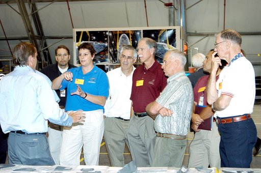 KENNEDY SPACE CENTER, FLA.  - In the Columbia Debris Hangar, Shuttle Launch Director Mike Leinbach answers questions from the Stafford-Covey Return to Flight Task Group (SCTG).  Chairing the task group are Richard O. Covey (fifth from left), former Space Shuttle commander, and Thomas P. Stafford, Ap