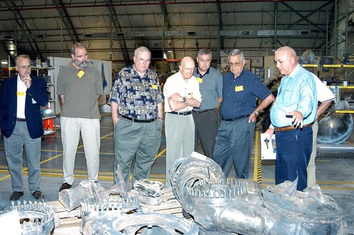 KENNEDY SPACE CENTER, FLA.  -  In the Columbia Debris Hangar, members of the  Stafford-Covey Return to Flight Task Group (SCTG) inspect some of the debris.   Chairing the task group are Richard O. Covey, former Space Shuttle commander, and Thomas P. Stafford (fourth from left), Apollo commander.  Ch