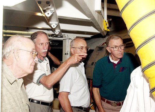 KENNEDY SPACE CENTER, FLA.  - As the Stafford-Covey Return to Flight Task Group (SCTG) tours the Orbiter Processing Facility, Richard O. Covey (second from left), former Space Shuttle commander, points to equipment.  Covey is co-chair of the SCTG along with Thomas P. Stafford, Apollo commander. Othe