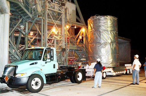 KENNEDY SPACE CENTER, FLA.  -  Before dawn, the Space Infrared Telescope Facility (SIRTF) arrives at Launch Pad 17-B, Cape Canaveral Air Force Station, where it will be lifted into the mobile service tower and prepared for launch.  SIRTF consists of three cryogenically cooled science instruments and