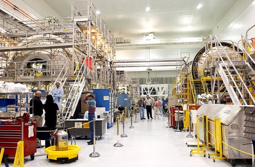 KENNEDY SPACE CENTER, FLA.  - In the Space Station Processing Facility can be seen the U.S. Node 2 (at left) and the Japanese Experiment Module (JEM)’s Pressurized Module (at right).  The  Italian-built Node 2, the second of three Space Station connecting modules, attaches to the end of the U.S. Lab
