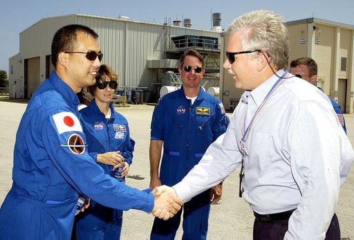 KENNEDY SPACE CENTER, FLA. -   The STS-114 crew is welcomed to Hangar AF, Cape Canaveral Air Force Station, by Joseph Chaput, with United Space Alliance. The crew, from left, are Mission Specialist Soichi Noguchi, Commander Eileen Collins, Mission Specialist Stephen Robinson and (partially hidden) P