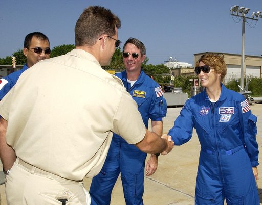 KENNEDY SPACE CENTER, FLA. -  Members of the STS-114 crew are welcomed to the Liberty Star, one of two SRB Retrieval Ships, by Captain Bren Wade (back to camera).  Crew members, from left, are Mission Specialist Soichi Noguchi, Mission Specialist Stephen Robinson and Commander Eileen Collins. Noguch