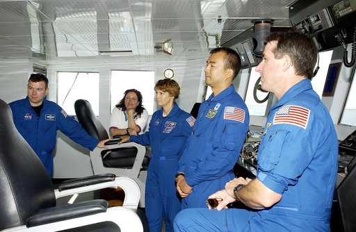 KENNEDY SPACE CENTER, FLA. -  The STS-114 crew visit the bridge of the Liberty Star, one of two SRB Retrieval Ships.  From left are Pilot James Kelly, Louise Kleba (with the Vehicle Integration Test Team (VITT) office), Commander Eileen Collins and Mission Specialists Soichi Noguchi and Stephen Robi