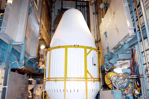 KENNEDY SPACE CENTER, FLA.  - In the mobile service tower on Launch Pad 17-B, Cape Canaveral Air Force Station, the top of the fairing is seen as it moves into place around the Space Infrared Telescope Facility (SIRTF). SIRTF will obtain images and spectra by detecting the infrared energy, or heat, 