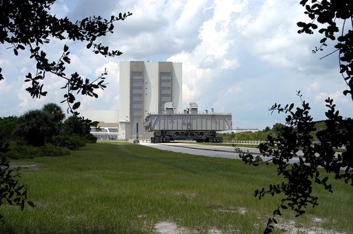 KENNEDY SPACE CENTER, FLA.  -Crawler-transporter (CT) number 2, moves away from the Vehicle Assembly Building, with a Mobile Launcher Platform on top, on a test run to the launch pad.  The CT recently underwent modifications to the cab.  The CT moves Space Shuttle vehicles between the VAB and launch