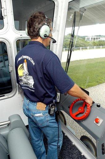 KENNEDY SPACE CENTER, FLA.  - Inside the cab of crawler-transporter (CT) number 2, driver Sam Dove, with United Space Alliance, operates the vehicle on a test run to the launch pad.  The CT recently underwent modifications to the cab.   The CT is transporting a Mobile Launch Platform (MLP).  The CT 