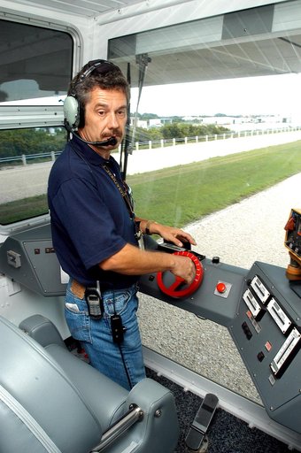 KENNEDY SPACE CENTER, FLA.  -  Inside the cab of crawler-transporter (CT) number 2, driver Sam Dove, with United Space Alliance, operates the vehicle on a test run to the launch pad.  The CT recently underwent modifications to the cab.   The CT is transporting a Mobile Launch Platform (MLP).  The CT