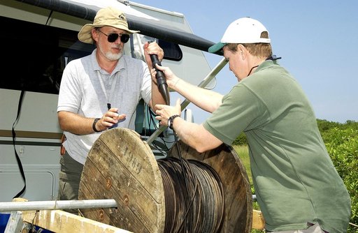 KENNEDY SPACE CENTER, FLA.  -  Research team members work with acoustic cable during underwater acoustic research being conducted in the Launch Complex 39 turn basin.  Several government agencies, including NASA, NOAA, the Navy, the Coast Guard, and the Florida Fish and Wildlife Commission are invol