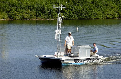 KENNEDY SPACE CENTER, FLA.  -  Researchers are positioned on one of the watercraft being utilized to conduct underwater acoustic research in the Launch Complex 39 turn basin.  Several government agencies, including NASA, NOAA, the Navy, the Coast Guard, and the Florida Fish and Wildlife Commission a