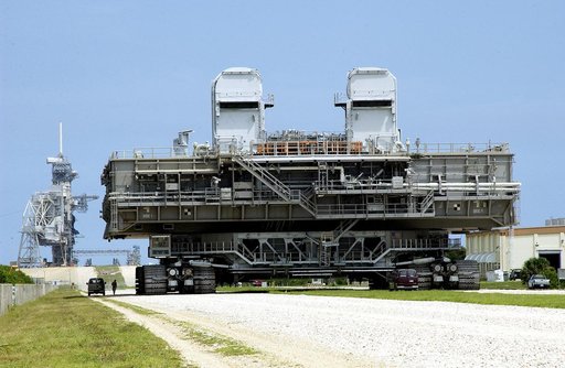 KENNEDY SPACE CENTER, FLA.  -   Crawler-transporter (CT) number 2 nears the launch pad with a Mobile Launcher Platform (MLP) on top.  After recent modifications to the cab and muffler system, the CT was taken on a test run.   The CT moves Space Shuttle vehicles, situated on the MLP, between the VAB 
