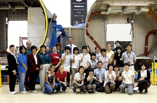 KENNEDY SPACE CENTER, FLA.  -   Japanese girls from Urawa Daiichi Girls High School, Urawa, Japan, pose for a group photo on their visit to the Spacehab facility in Cape Canaveral, Fla.  They were awarded the trip when their experiments were chosen to fly on mission STS-107.  The group was also meet