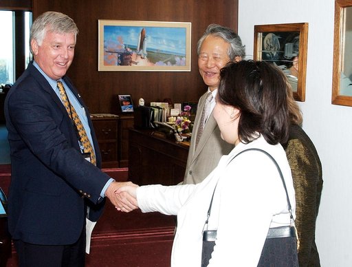 KENNEDY SPACE CENTER, FLA. - KSC Director James W. Kennedy receives Consul General of Japan Ko Kodaira and his family in his office in Headquarters Building during their visit to Kennedy Space Center (KSC).  From left are Kennedy, Kodaira, his wife Marie (partially hidden), and his daughter Reiko. K