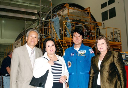 KENNEDY SPACE CENTER, FLA. - From left, the Consul General of Japan Ko Kodaira, his daughter Reiko, astronaut Dr. Takao Doi, and Kodaira's wife Marie pause for a photograph in the Space Station Processing Facility during their visit to Kennedy Space Center (KSC). Doi represented Japan on Space Shutt