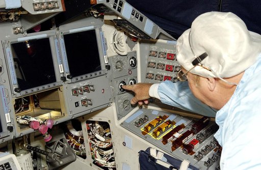 KENNEDY SPACE CENTER, FLA.  -   During power-up of the orbiter Discovery in the Orbiter Processing Facility, a technician turns on a switch.  Discovery has been undergoing Orbiter Major Modifications in the past year, ranging from wiring, control panels and black boxes to gaseous and fluid systems t