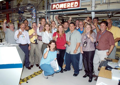 KENNEDY SPACE CENTER, FLA.  -  In the Orbiter Processing Facility, the processing team celebrates the  successful power-up of the orbiter Discovery.  The vehicle has been undergoing Orbiter Major Modifications in the past year, ranging from wiring, control panels and black boxes to gaseous and fluid