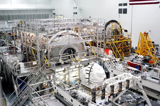 KENNEDY SPACE CENTER, FLA. - In the Space Station Processing Facility, the U.S. Node 2 (center) and the Japanese Experiment Module (JEM), background right, await a Multi-Element Integrated Test (MEIT). Node 2 attaches to the end of the U.S. Lab on the International Space Station and provides attach 
