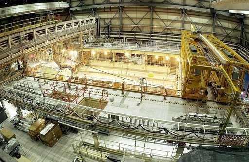 KENNEDY SPACE CENTER, FLA. -  This bird's-eye view of a high bay in the Orbiter Processing Facility (OPF) shows the open payload bay of Space Shuttle Discovery surrounded by the standard platforms and equipment required to process a Space Shuttle orbiter.  The high bay is 197 feet (60 meters) long, 
