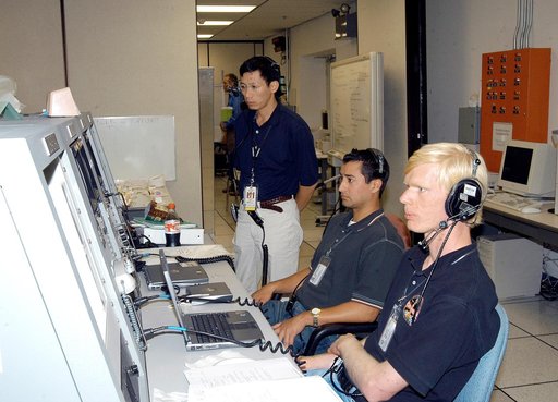 KENNEDY SPACE CENTER, FLA. -   Workers in the Space Station Processing Facility observe consoles during a Multi-Element Integrated Test (MEIT) of the U.S. Node 2 and the Japanese Experiment Module (JEM).   Node 2 attaches to the end of the U.S. Lab on the ISS and provides attach locations for the Ja