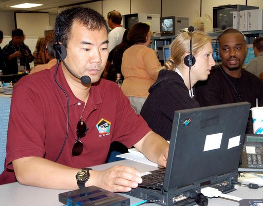 KENNEDY SPACE CENTER, FLA. -   Astronaut Soichi Noguchi, with the National Space Development Agency of Japan (NASDA), works at a console during a Multi-Element Integrated Test (MEIT) of the U.S. Node 2 and the Japanese Experiment Module (JEM).  Noguchi is assigned to mission STS-114 as a mission spe