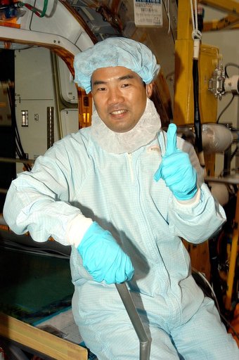 KENNEDY SPACE CENTER, FLA. -  Astronaut Soichi Noguchi, with the National Space Development Agency of Japan (NASDA), signals success during a Multi-Element Integrated Test (MEIT ) of the Japanese Experiment Module (JEM) in the Space Station Processing Facility.  Noguchi is assigned to mission STS-11