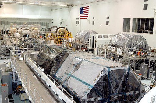 KENNEDY SPACE CENTER, FLA. -  Various elements intended for the International Space Station are lined up in the Space Station Processing Facility.  The newest to arrive at KSC are in the rear: at left, the U.S. Node 2, and next to it at right, the Japanese Experiment Module (JEM).  The two elements 