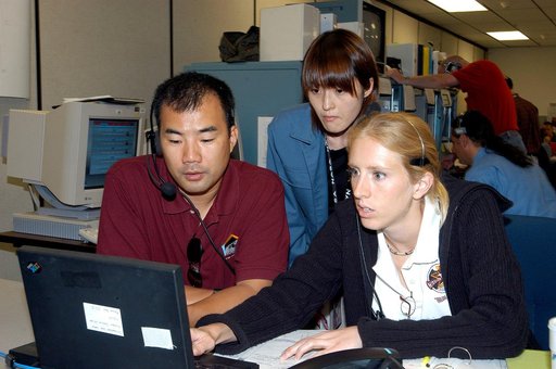 KENNEDY SPACE CENTER, FLA. -  Astronaut Soichi Noguchi (left), with the National Space Development Agency of Japan (NASDA), works at a console during a Multi-Element Integrated Test (MEIT) of the U.S. Node 2 and the Japanese Experiment Module (JEM) in the Space Station Processing Facility.  The JEM,