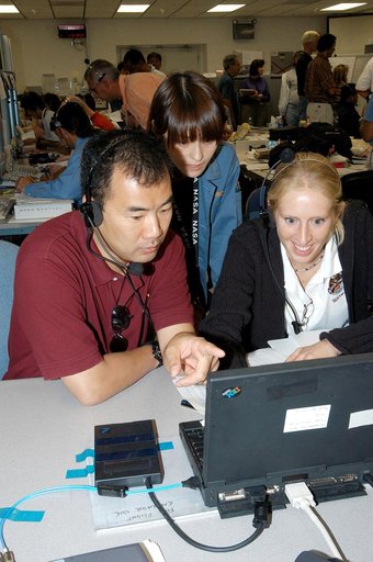 KENNEDY SPACE CENTER, FLA. -  Astronaut Soichi Noguchi (left), with the National Space Development Agency of Japan (NASDA), points to data on the console during a Multi-Element Integrated Test (MEIT) of the U.S. Node 2 and the Japanese Experiment Module (JEM) in the Space Station Processing Facility