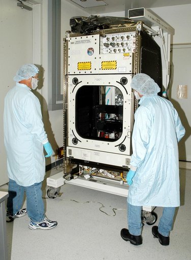 KENNEDY SPACE CENTER, FLA. -  Workers in the Space Station Processing Facility check out the Window Observational Research Facility (WORF),  designed and built by the Boeing Co. at NASA’s Marshall Space Flight Center in Huntsville, Ala.   WORF will be delivered to the International Space Station and