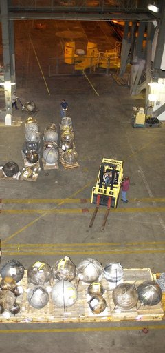 KENNEDY SPACE CENTER, FLA. -  Pieces of Columbia debris are offloaded from a flatbed truck in the transfer aisle of the Vehicle Assembly Building (VAB).  The debris is being moved from the Columbia Debris Hangar to the VAB for permanent storage.  More than 83,000 pieces of debris were shipped to KSC