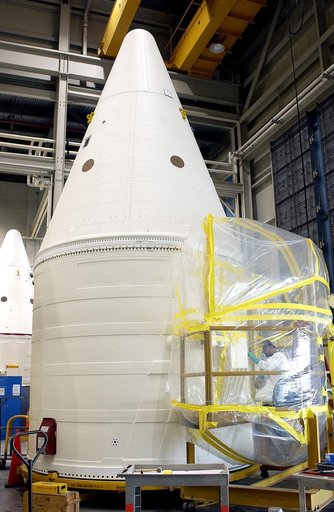 KENNEDY SPACE CENTER, FLA. - In the Solid Rocket Booster Assembly and Refurbishment Facility (ARF), Vernon Gibbs, with United Space Alliance, prepares the forward skirt of a solid rocket booster for installation of the parachute camera.  Refurbishment and subassembly of Shuttle SRB hardware - primar