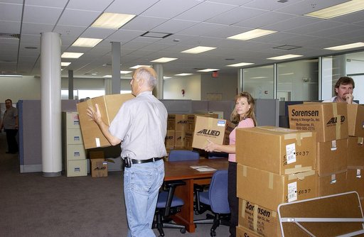 KENNEDY SPACE CENTER, FLA. -  Ivan Rodriguez, with Bionetics, and Michelle Crouch and Larry Burns, with Dynamac, carry boxes of equipment into the Space Life Sciences Lab (SLSL), formerly known as the Space Experiment Research and Processing Laboratory (SERPL).    They are transferring equipment fro