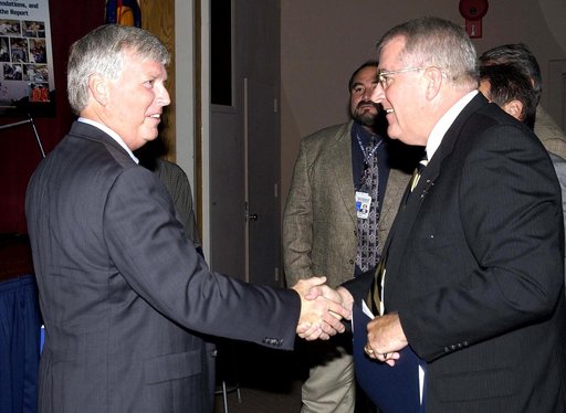 KENNEDY SPACE CENTER, FLA. -  Center Director Jim Kennedy (left) welcomes Bill Pickavance to the podium during the CD’s first all-hands meeting with employees. Pickavance is vice president and deputy program manager, Florida operations, United Space Alliance. Also, making presentations were Dr. Wood