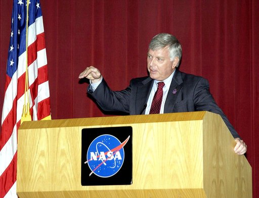 KENNEDY SPACE CENTER, FLA. -  Center Director Jim Kennedy talks to employees during his first all-hands meeting. Making presentations were Dr. Woodrow Whitlow Jr., KSC deputy director;Tim Wilson, assistant chief engineer for Shuttle; and Bill Pickavance, vice president and deputy program manager, Fl