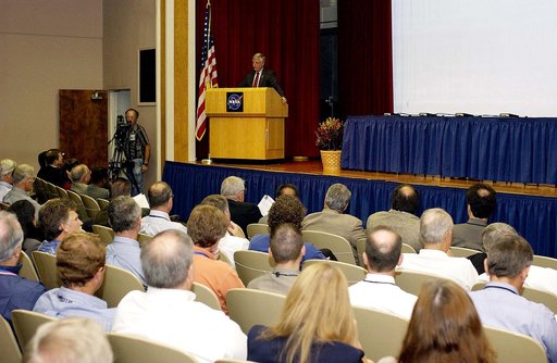 KENNEDY SPACE CENTER, FLA. -  Center Director Jim Kennedy talks to employees during his first all-hands meeting. Making presentations were Dr. Woodrow Whitlow Jr., KSC deputy director; Tim Wilson, assistant chief engineer for Shuttle; and Bill Pickavance, vice president and deputy program manager, F