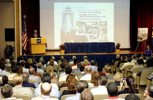 KENNEDY SPACE CENTER, FLA. -  Center Director Jim Kennedy talks to employees during his first all-hands meeting. Making presentations were Dr. Woodrow Whitlow Jr., KSC deputy director; Tim Wilson, assistant chief engineer for Shuttle; and Bill Pickavance, vice president and deputy program manager, F