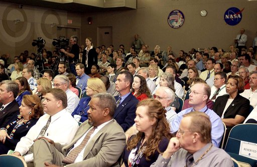 KENNEDY SPACE CENTER, FLA. -  Employees in the Training Auditorium listen to  Center Director Jim Kennedy’s first all-hands meeting for employees.  Making presentations were Dr. Woodrow Whitlow Jr., KSC deputy director; Tim Wilson, assistant chief engineer for Shuttle; and Bill Pickavance, vice pres