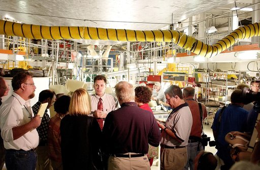 KENNEDY SPACE CENTER, FLA. -  NASA Vehicle Manager Scott Thurston (facing camera) talks to the media in the Orbiter Processing Facility.  The media was invited to see the orbiter Atlantis as it is being prepared for Return to Flight.  Both local and national reporters representing print and TV netwo