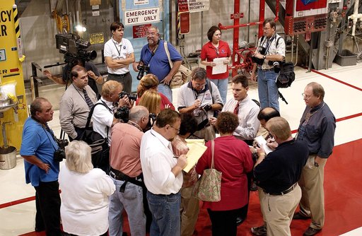 KENNEDY SPACE CENTER, FLA. -   The media gather around NASA Vehicle Manager Scott Thurston (white shirt, right) who talks about some of the work being done on the orbiter Atlantis as it is being prepared for Return to Flight in the Orbiter Processing Facility.   Both local and national reporters rep