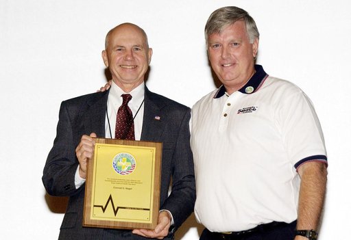 KENNEDY SPACE CENTER, FLA. -     Center Director Jim Kennedy (right) presents a plaque to Conrad Nagel who organized the Spaceport Super Safety and Health Day at KSC, an annual event dedicated to reinforcing safe and healthful behaviors in the workforce.  Nagel is chief of the Shuttle Project Office