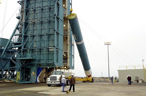 VANDENBERG AFB, CALIF. -  The first stage of the Delta II launch vehicle for the Gravity Probe B experiment is raised to a vertical position at Space Launch Complex 2, Vandenberg Air Force Base, Calif.  The Gravity Probe B will launch a payload of four gyroscopes into low-Earth polar orbit to test t
